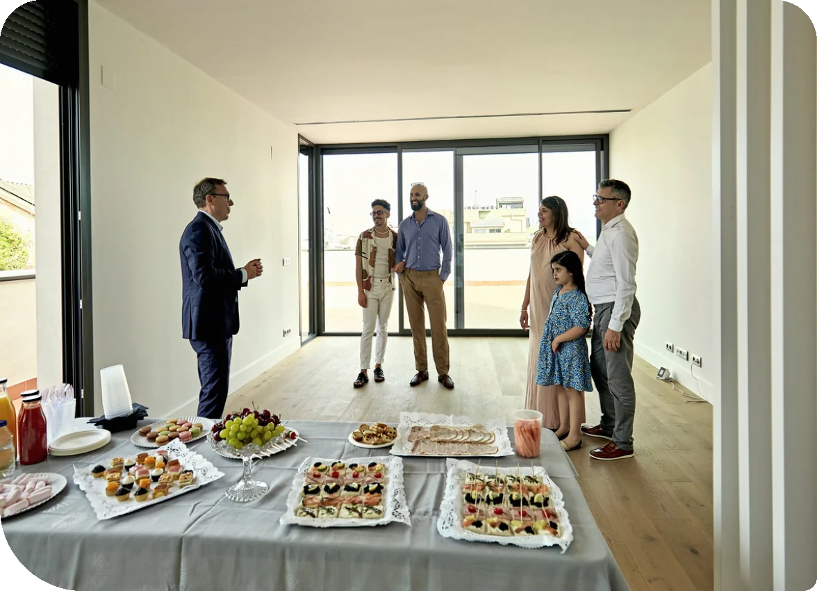 Real Estate Agent and Prospective Buyers at Open House